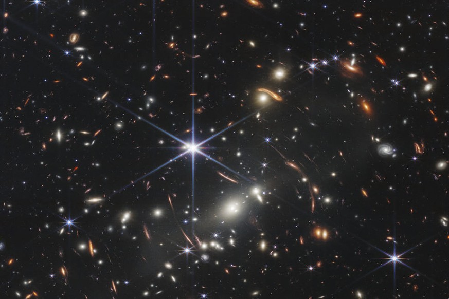 This image provided by NASA on Monday, July 11, 2022, shows galaxy cluster SMACS 0723, captured by the James Webb Space Telescope. The telescope is designed to peer back so far that scientists can get ...