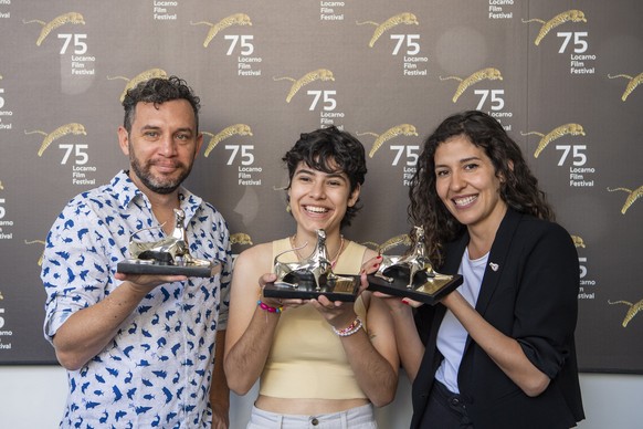 epa10118672 Actor Reinaldo Amien Gutierrez (L) poses with the Pardo for Best Actor award, actor Daniela Marin Navarro (C) poses with the Pardo for Best Actress award and director Valentina Maurel of t ...