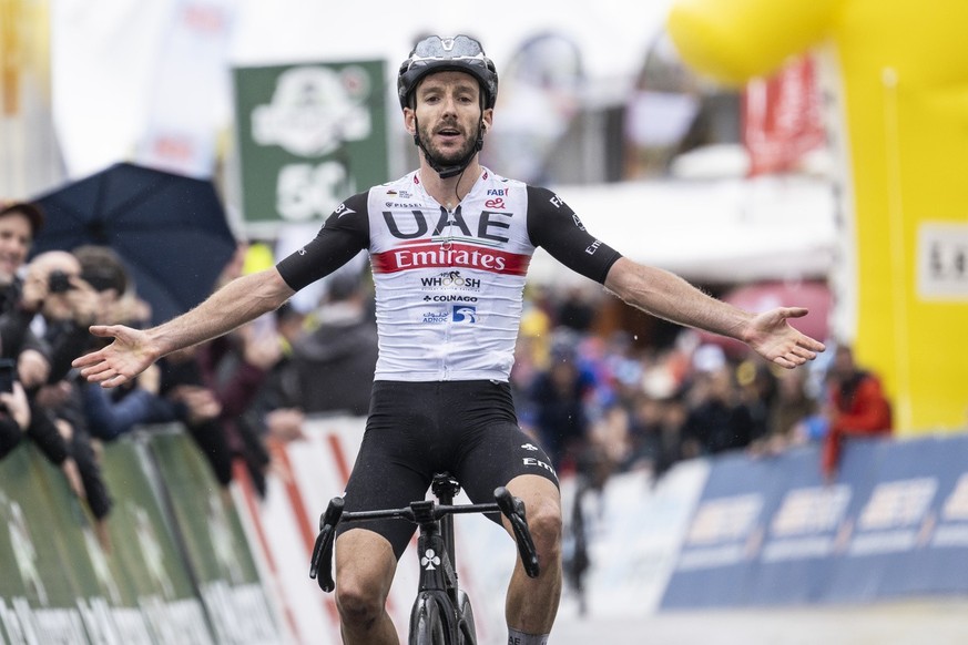 Adam Yates from Great Britain of UAE Team Emirates crosses the finish line as the winner of the fourth stage, a 161,6 km race between Sion and Thyon 2000 at the 76th Tour de Romandie UCI World Tour Cy ...