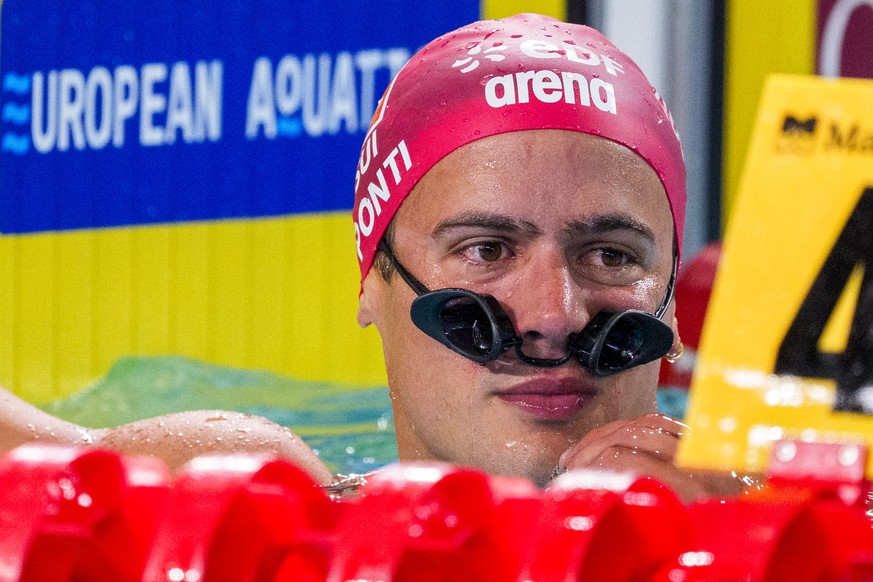 Swiss swimmer Noe Ponti reacts after dropping his goggles during the Men's 50m Butterfly Final and finishing 8th during the European Aquatics Swimming Championships in Paris, France, Tuesday, Aug ...