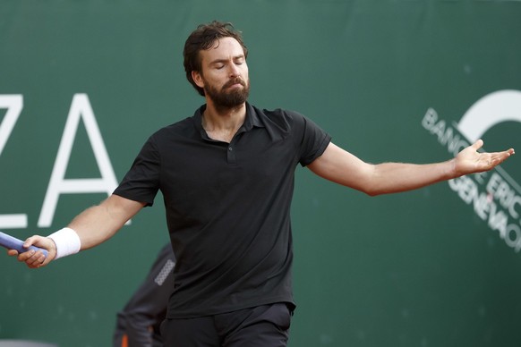 Ernests Gulbis, of Latvia, reacts after losing a point against Alexander Zverev, of Germany, during their second round match, at the ATP 250 Geneva Open tournament in Geneva, Switzerland, Tuesday, May ...