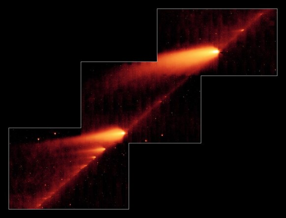 Cette image infrarouge du télescope spatial Spitzer de la NASA montre la comète brisée 73P/Schwassman-Wachmann 3 effleurant une traînée de débris laissée lors de ses multiples voyages autour du soleil ...
