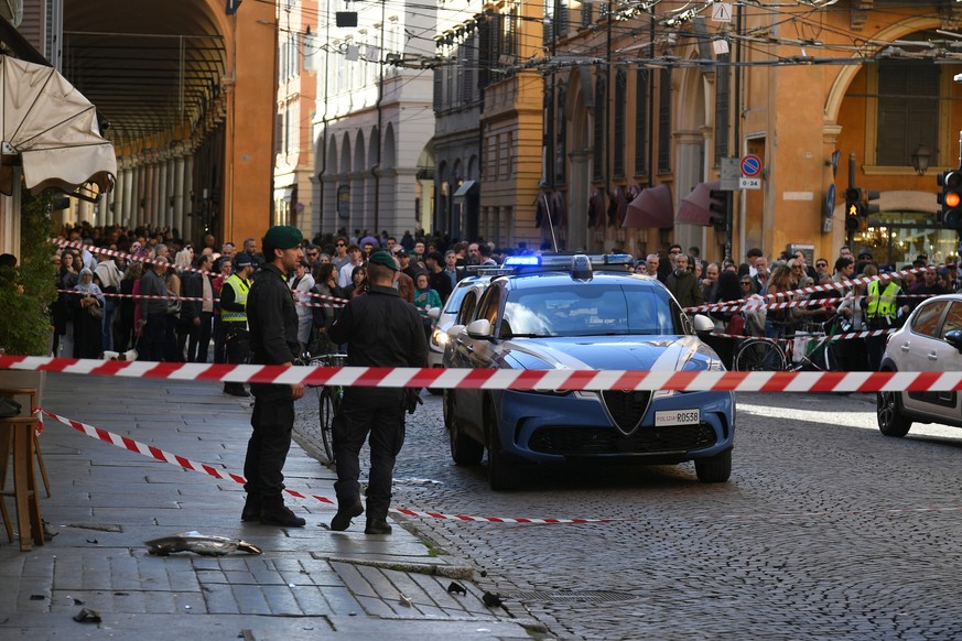 KEYPIX - Financial Police patrol a scene after a car incident in a street of Modena, Italy, Saturday, May 16, 2026. (Lapresse via AP)