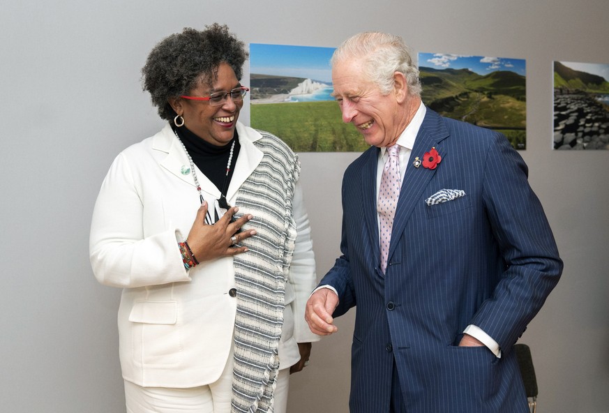 Britain's Prince Charles, right, greets Barbados' Prime Minister Mia Amor Mottley ahead of their bilateral during the COP26 summit at the Scottish Event Campus (SEC) in Glasgow, Monday, Nov. ...