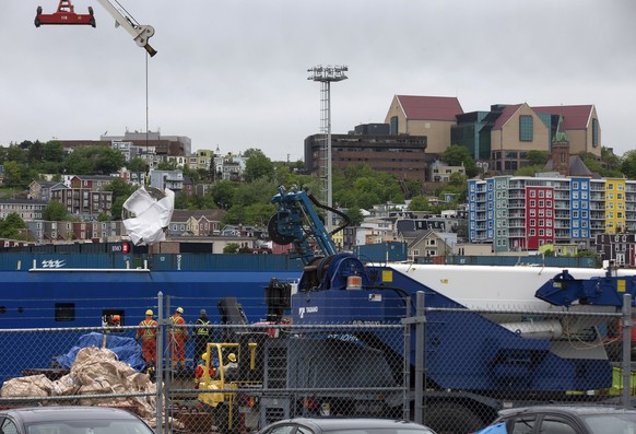 Debris from the Titan submersible, recovered from the ocean floor near the wreck of the Titanic, is unloaded from the ship Horizon Arctic at the Canadian Coast Guard pier in St. John's, Newfoundl ...