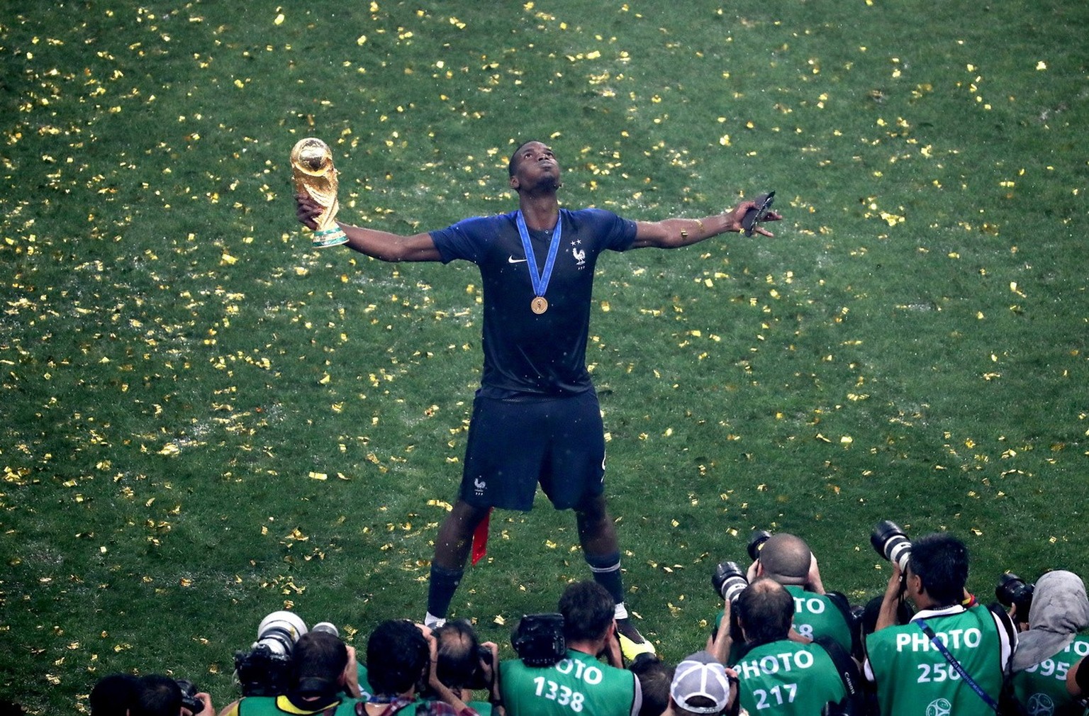 epa06891469 French player Paul Pogba reacts with the trophy after winning the FIFA World Cup 2018 final between France and Croatia in Moscow, Russia, 15 July 2018.....(RESTRICTIONS APPLY: Editorial Us ...