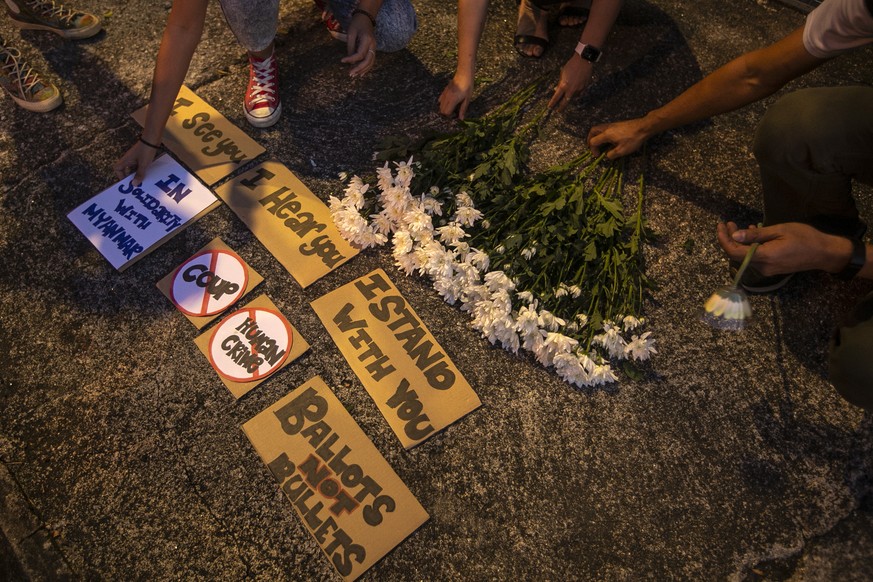 epa09065373 Supporters of democracy in Myanmar make preparations during a candle light vigil in Kuala Lumpur, Malaysia, 10 March 2021. Anti-coup protests continue in Myanmar amid intensifying violent  ...