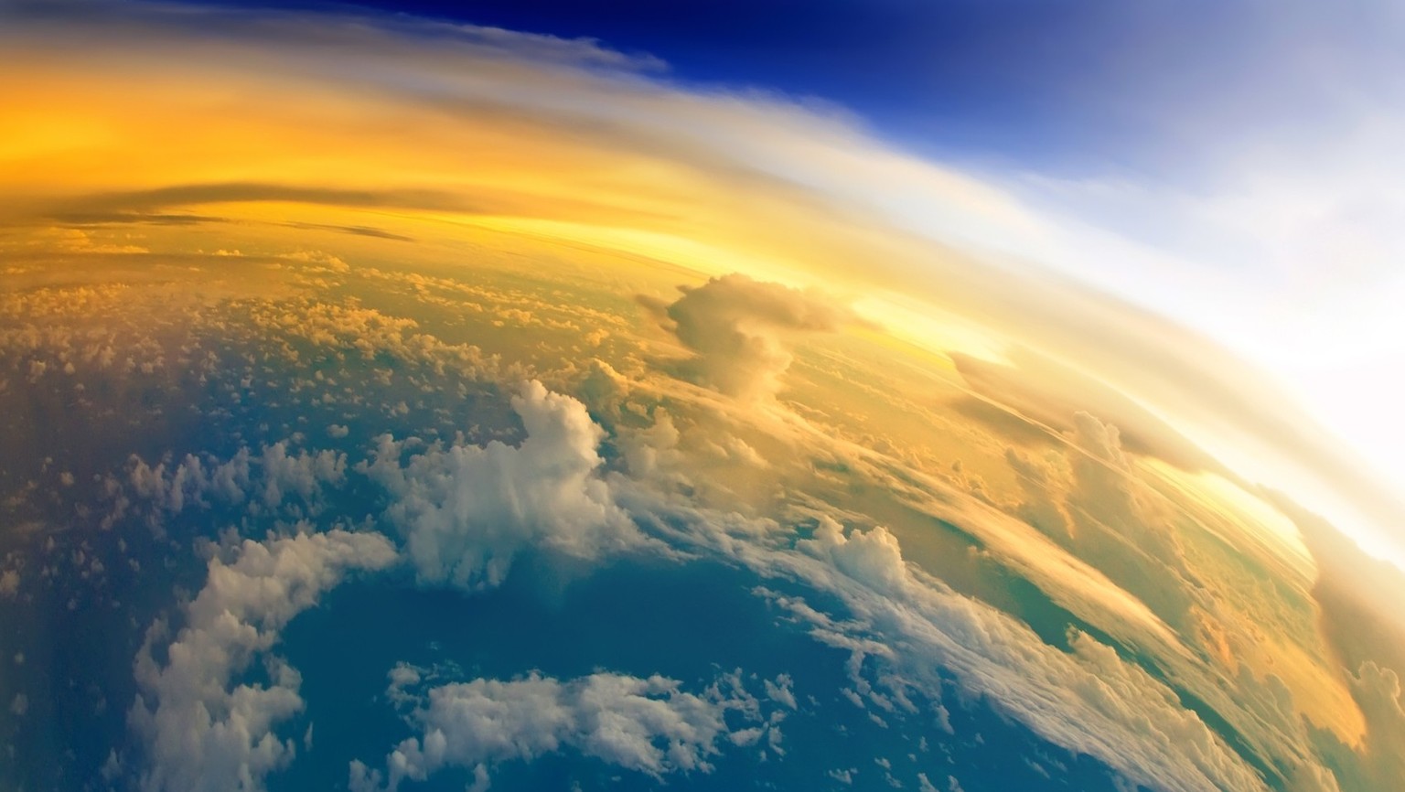 &quot;Aerial view of Planet Earth with clouds, horizon and little bit of space, make feelings of being in heaven. Dramatic clouds and orange sunlight all over the planet. Cloudscape and stratosphere f ...
