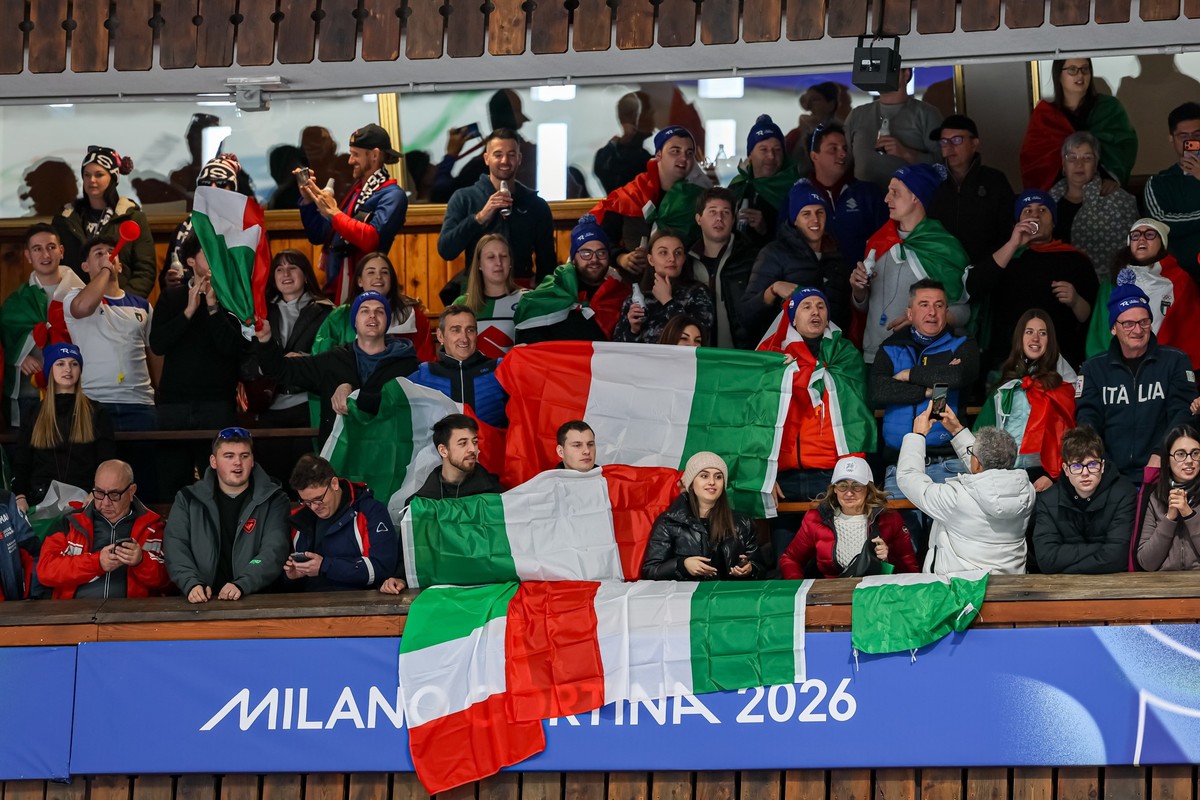 epa12734113 Italian fans celebrate during the Men's Curling match between Italy and Great Britain at the Milano Cortina 2026 Winter Olympic Games, in Cortina, Italy, 13 February 2026. EPA/ANDREA  ...