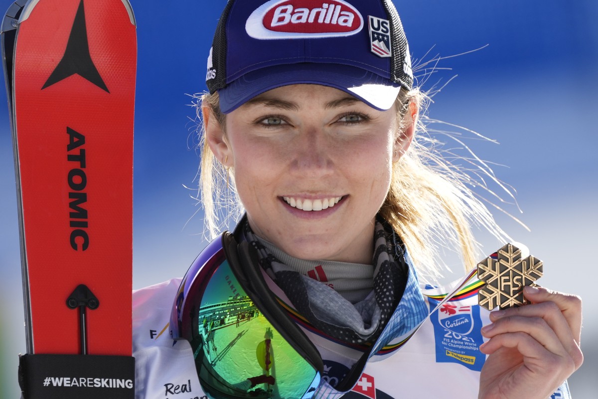 United States' Mikaela Shiffrin shows her bronze medal on the podium of the women's slalom, at the alpine ski World Championships in Cortina d'Ampezzo, Italy, Saturday, Feb. 20, 2021. ( ...
