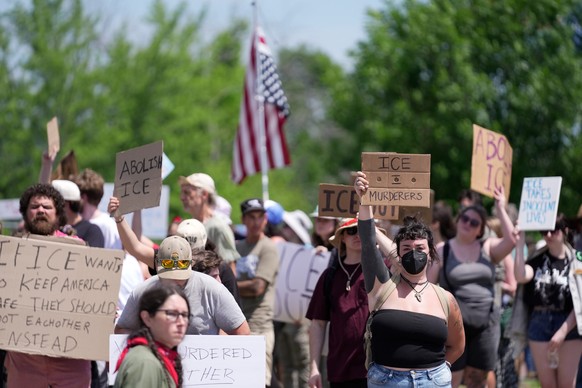 Protesters gather near the scene of a shooting involving U.S. Immigration and Customs Enforcement, Monday, July 13, 2026 in Biddeford, Maine. (AP Photo/Robert F. Bukaty)
ICE Shooting Maine