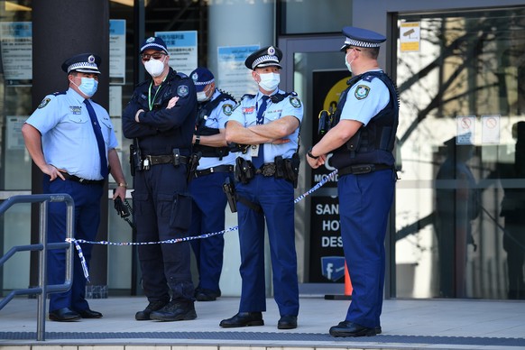 epa09462932 New South Wales (NSW) Police officers patrol outside Bankstown Police Station in Sydney, Australia, 12 September 2021. A protest was planned after a man had a medical episode while he was  ...