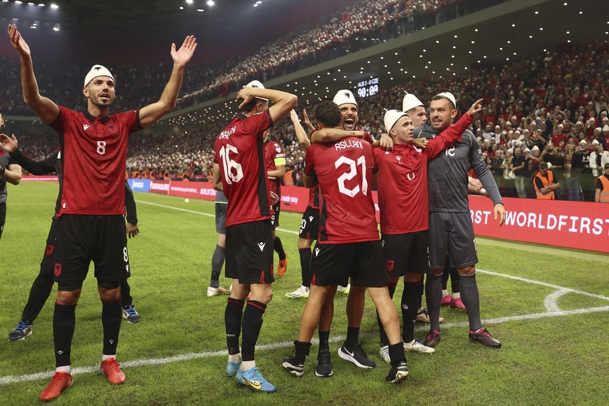 Albania players celebrate their victory at the Euro 2024 group E qualifying soccer match between Albania and Czech Republic at Air Albania stadium in Tirana, Albania, Thursday, Oct. 12, 2023. (AP Phot ...
