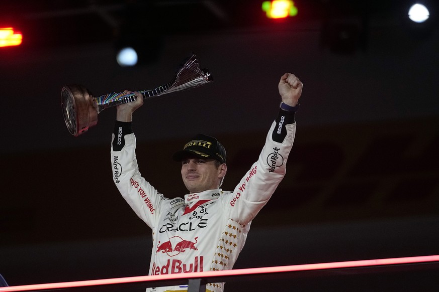 Red Bull driver Max Verstappen, of the Netherlands, celebrates on the podium after winning the Formula One Las Vegas Grand Prix auto race, Saturday, Nov. 18, 2023, in Las Vegas. (AP Photo/Darron Cummi ...