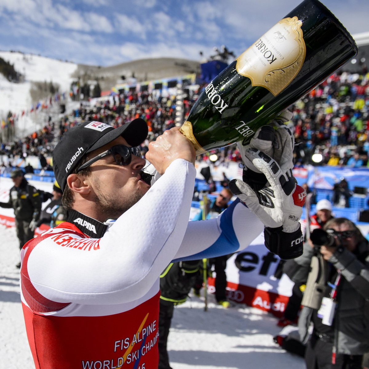 epa04608297 Patrick Kueng of Switzerland celebrates his gold medal during the flower ceremony after the Men's Downhill at the FIS Alpine World Ski Championships in Beaver Creek, Colorado, USA, 07 ...