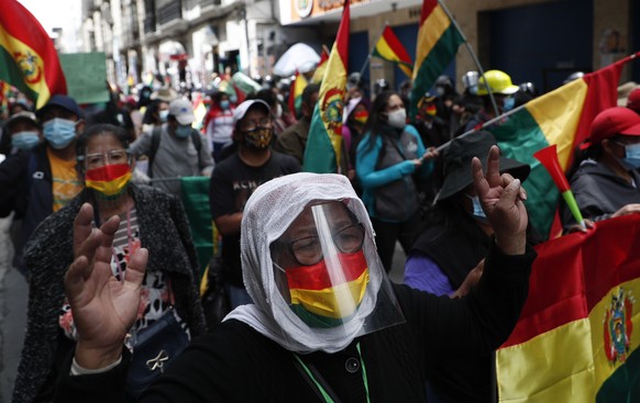 Supporters of Bolivia&#039;s former Interim President Jeanine Áñez shout slogans against the government of Luis Arce during a protest in La Paz, Bolivia, Wednesday, March 17, 2021, amid the COVID-19 p ...