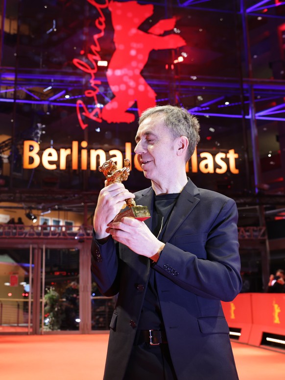 epa11916588 Dag Johan Haugerud poses with the Golden Bear for Best Film trophy after the closing ceremony of the 75th Berlin International Film Festival &#039;Berlinale&#039;, in Berlin, Germany, 22 F ...