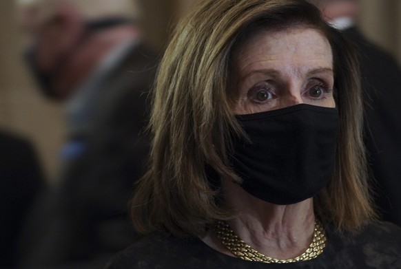 epa08983086 Speaker of the United States House of Representatives Nancy Pelosi pays her respects to the remains of late U.S. Capitol Police Officer Brian D. Sicknick, as he lies in honor in the Capito ...