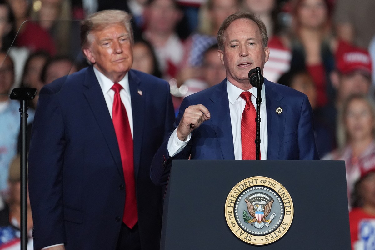 President Donald Trump listens as Republican U.S. Senate candidate Texas Attorney General Ken Paxton speaks at a campaign rally at the Freeman Coliseum in San Antonio, Wednesday, Oct. 7, 2026. (AP Pho ...