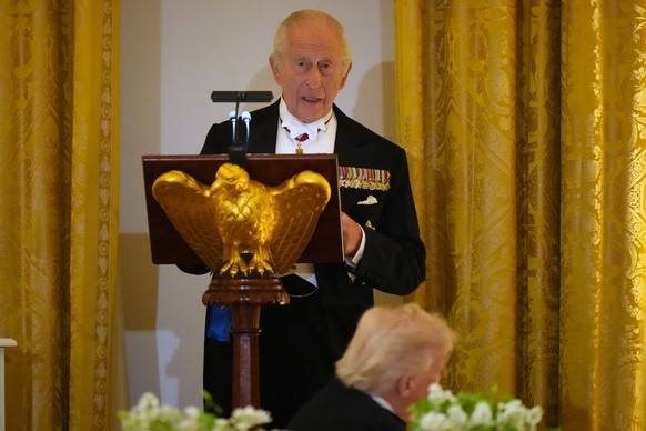 Britain's King Charles III speaks during a State Dinner with President Donald Trump, first lady Melania Trump and Queen Camilla in the East Room of the White House State Dinner Tuesday, April 28, ...