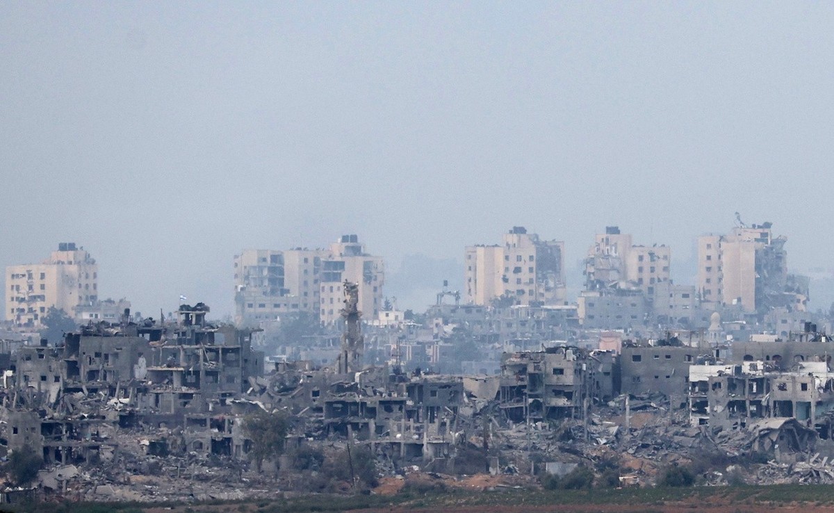 epa10972829 Damaged buildings in the northern Gaza Strip following Israeli airstrikes, as seen from Sderot, Israel, 13 November 2023. More than 11,000 Palestinians and at least 1,200 Israelis have bee ...