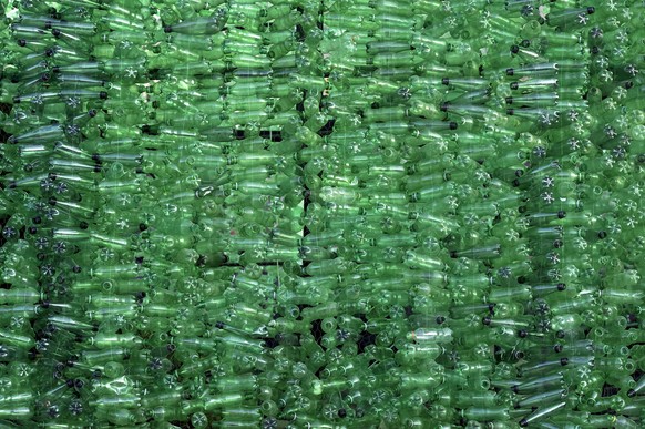 epa10360355 A close up of the 18-meter-high Christmas tree made of discarded plastic bottles at the entrance of Bnachii Lake, Zgharta district, northern Lebanon, 10 December 2022. The Christmas tree w ...