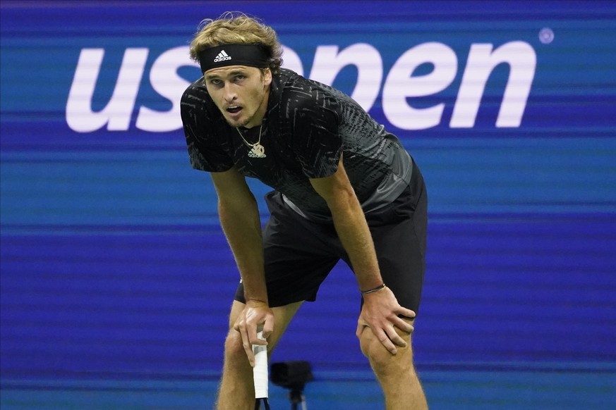 Alexander Zverev, of Germany, reacts after losing a point to Novak Djokovic, of Serbia, during the semifinals of the US Open tennis championships, Friday, Sept. 10, 2021, in New York. (AP Photo/Elise  ...