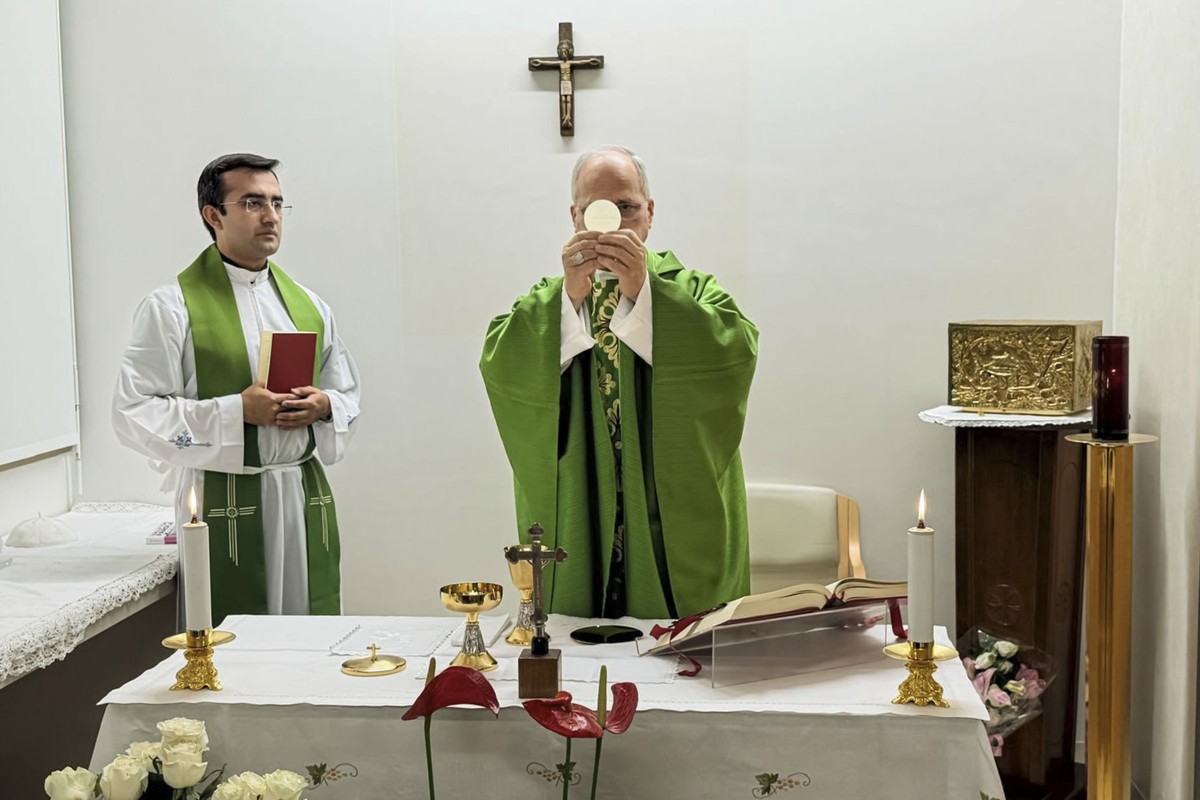 This picture, released by Vatican Media on Friday, Oct. 16, 2026, shows Pope Leo XIV, flanked by his personal secretary, Monsignor Edgard Iván Rimaycuna Inga, left, celebrating Mass at the Agostino Ge ...