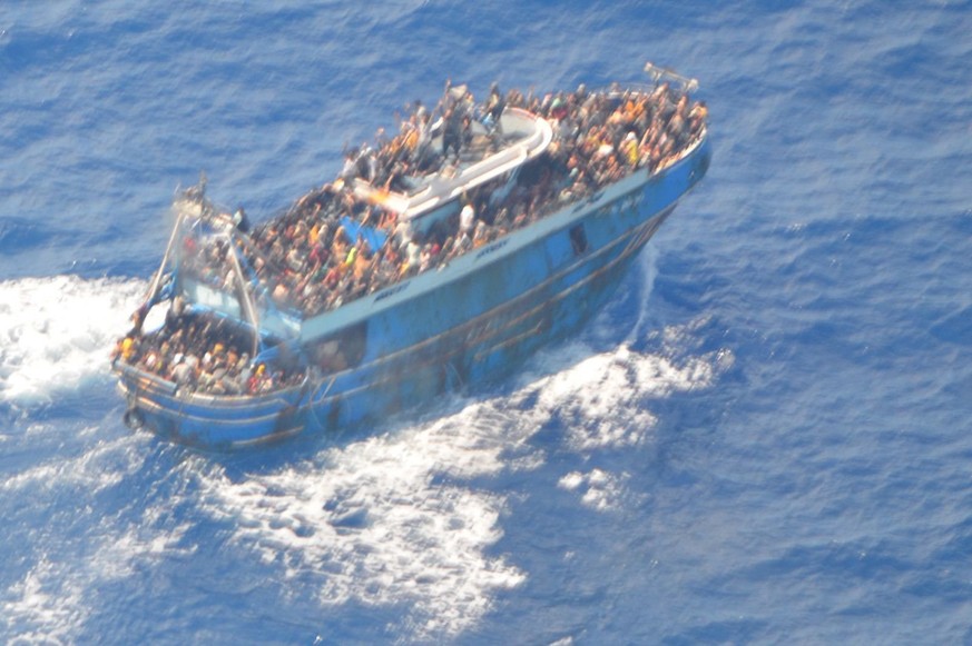 epa10691107 A handout photo made available by the Hellenic Coast Guard on June 14, 2023 shows a fishing vessel carrying a large number of migrants in international waters, near the western Peloponnese…
