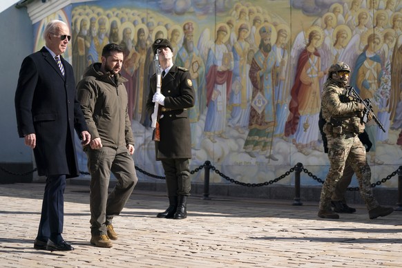 U.S. President Joe Biden, left, walks with Ukrainian President Volodymyr Zelenskyy to St. Michael's Cathedral with the golden dome during an unannounced visit in Kyiv, Ukraine, Monday, Feb. 20, 2023. (AP Photo/…