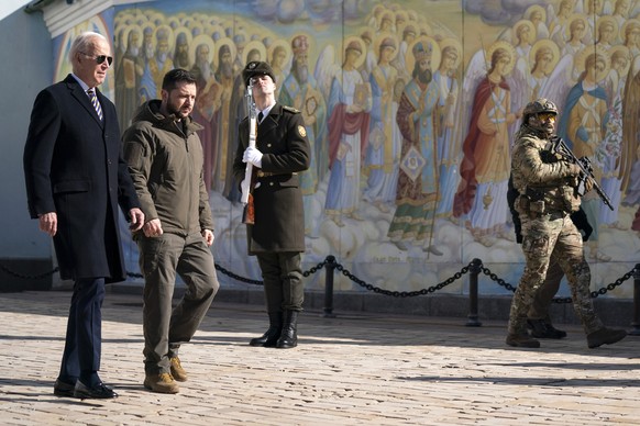 US President Joe Biden, left, walks with Ukrainian President Volodymyr Zelenskyy at St. Michaels Golden-Domed Cathedral during an unannounced visit, in Kyiv, Ukraine, Monday, Feb. 20, 2023. (AP Photo/ ...