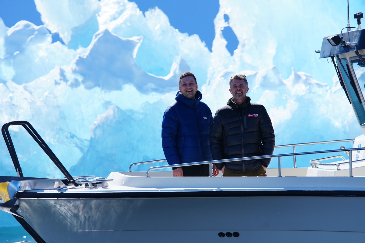 epa12062635 Denmark's King Frederik X (R) and Greenland's Prime Minister Jens-Frederik Nielsen (L) stand in front of an iceberg during a boat trip in Nuuk Fjord, Greenland, 29 April 2025. EP ...