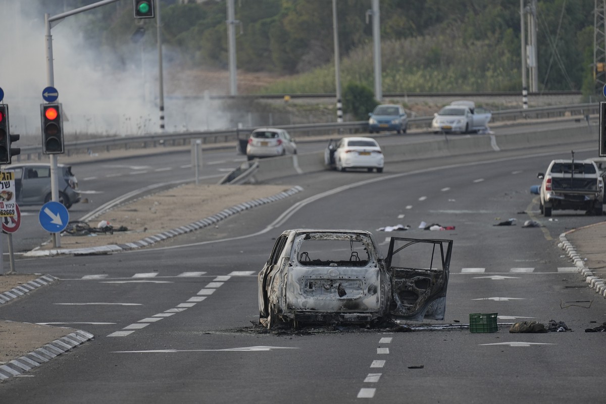 A car destroyed in an attack by Palestinian militants is seen in Sderot, Israel, on Saturday, Oct. 7, 2023. Palestinian militants in the Gaza Strip infiltrated Saturday into southern Israel and fired  ...