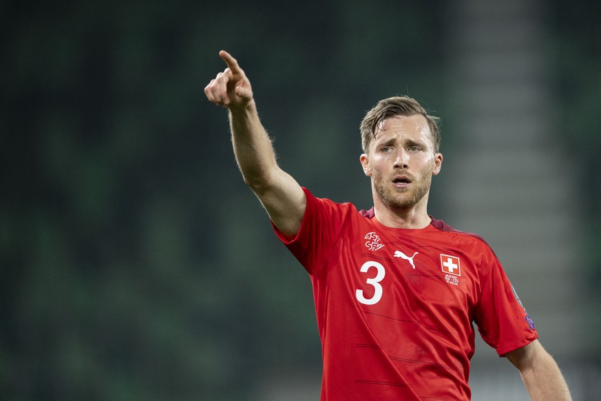 Silvan Widmer reacts during the FIFA World Cup Qatar 2022 qualifying Group C soccer match between Switzerland and Lithuania, at the kybunpark stadium in St. Gallen, Switzerland, Sunday, March 28, 2021 ...