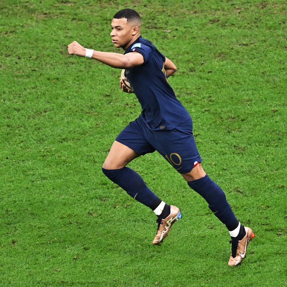 epa10372535 Kylian Mbappe of France celebrates the 2-1 goal during the FIFA World Cup 2022 Final between Argentina and France at Lusail stadium, Lusail, Qatar, 18 December 2022. EPA/Noushad Thekkayil