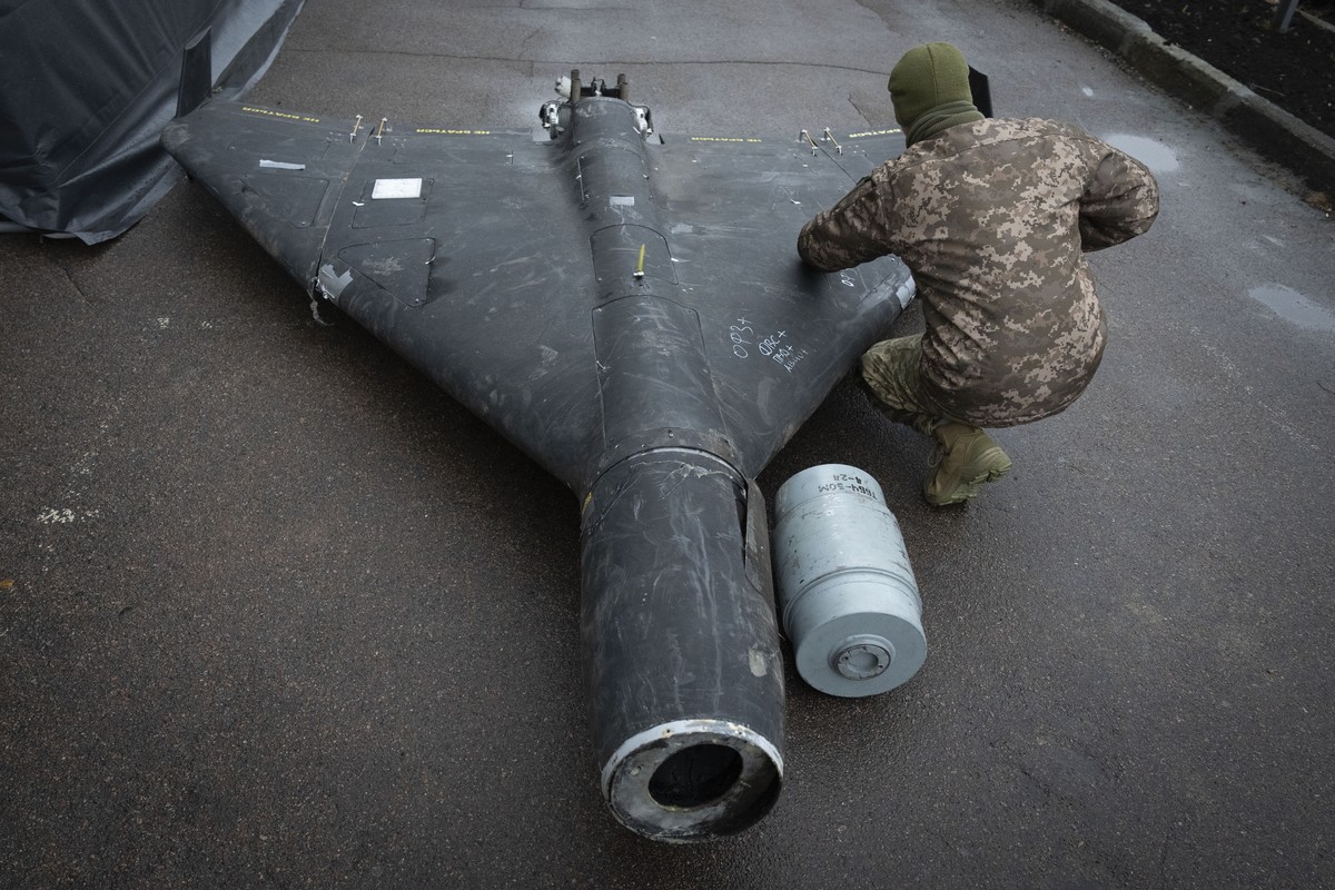 A Ukrainian officer examines a downed Shahed drone with thermobaric charge launched by Russia in a research laboratory in an undisclosed location in Ukraine Thursday, Nov. 14, 2024. (AP Photo/Efrem Lu ...