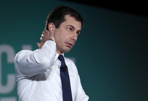 Democratic presidential candidate Pete Buttigieg, mayor of South Bend, Ind., reflects on the news of a mass shooting in El Paso, Texas, during an appearance at an American Federation of State, County  ...