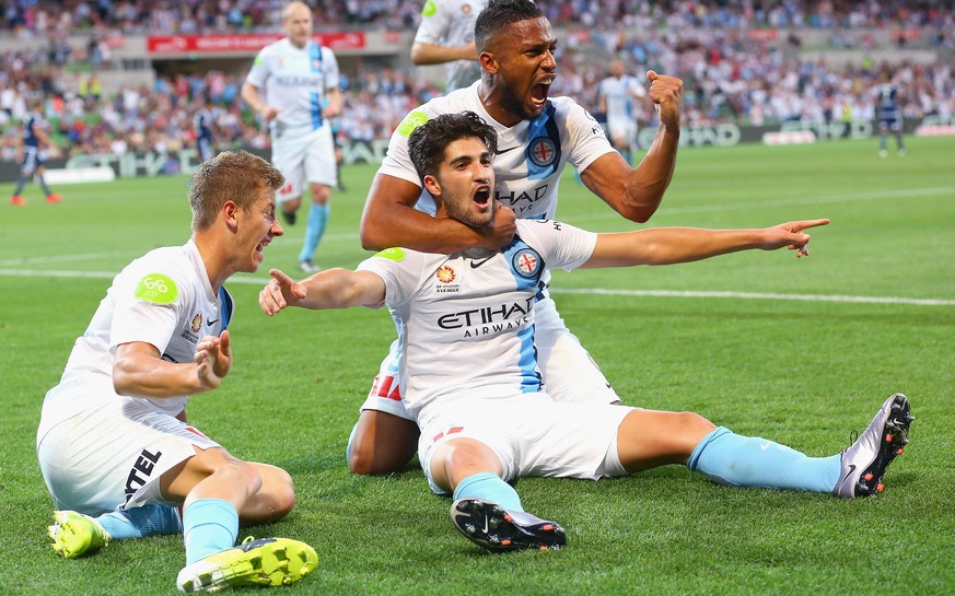 MELBOURNE, AUSTRALIA - DECEMBER 19: Paulo Retre of the City is congratulated by team mates after scoring a goal during the round 11 A-League match between Melbourne City FC and Melbourne Victory at AA ...