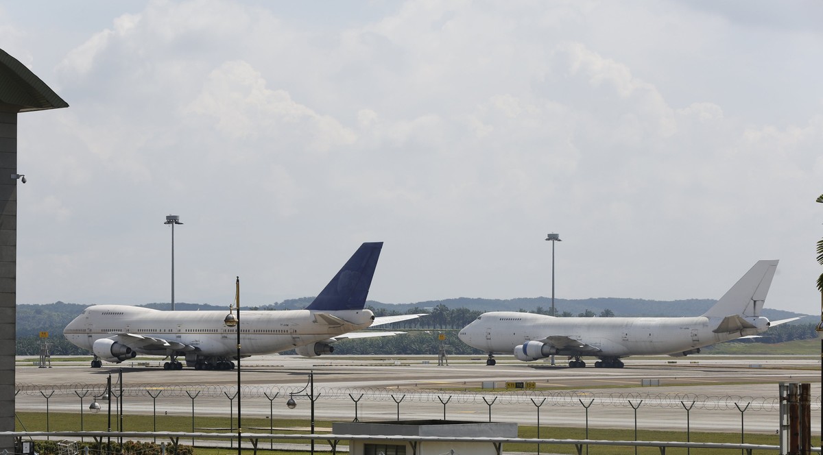 Two of three abandoned Boeing 747-200F planes are seen parked on the tarmac at Kuala Lumpur International Airport in Sepang, Malaysia, December 10, 2015. Malaysia's airport operator took out news ...