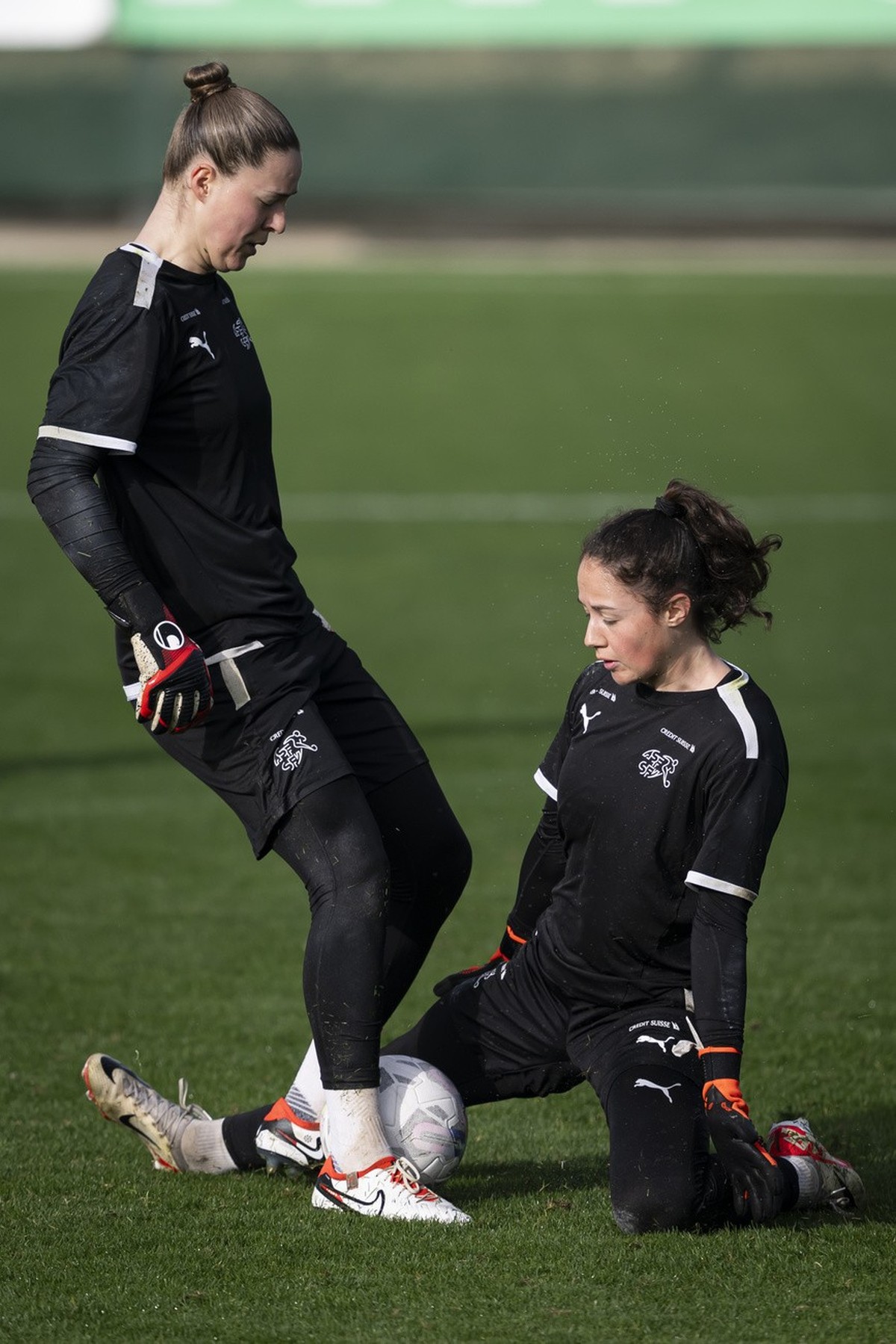 Switzerland's goalkeeper Elvira Herzog, left, and Switzerland's goalkeeper Livia Peng, right, fight for the ball during a training session at Arroyo Enmedio by Marbella Football Center, in E ...