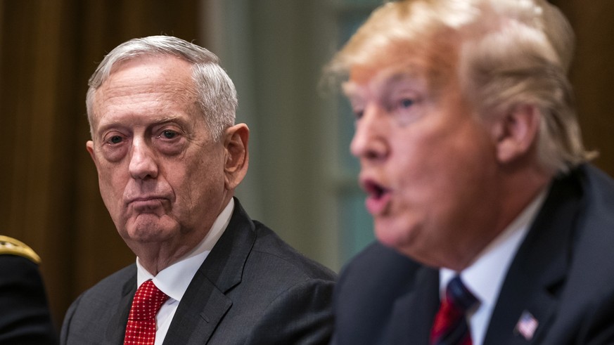 epa07242840 (FILE) - US Defense Secretary James Mattis (C) listens to President Donald J. Trump (R) speaking to the media before meeting with senior military advisors in the Cabinet Room of the White  ...