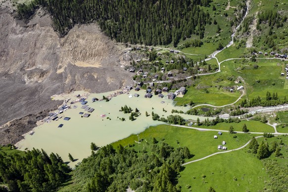 A aerial view captured one day after a massive avalanche, triggered by the collapse of the Birch Glacier, shows the destruction it caused as it swept down to the valley floor and demolishing the villa ...