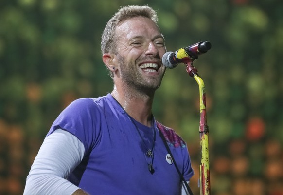 Singer Chris Martin, of Coldplay, performs at the FedEx Field on Sunday, Aug. 6, 2017, in Landover, Md. (Photo by Brent N. Clarke/Invision/AP)