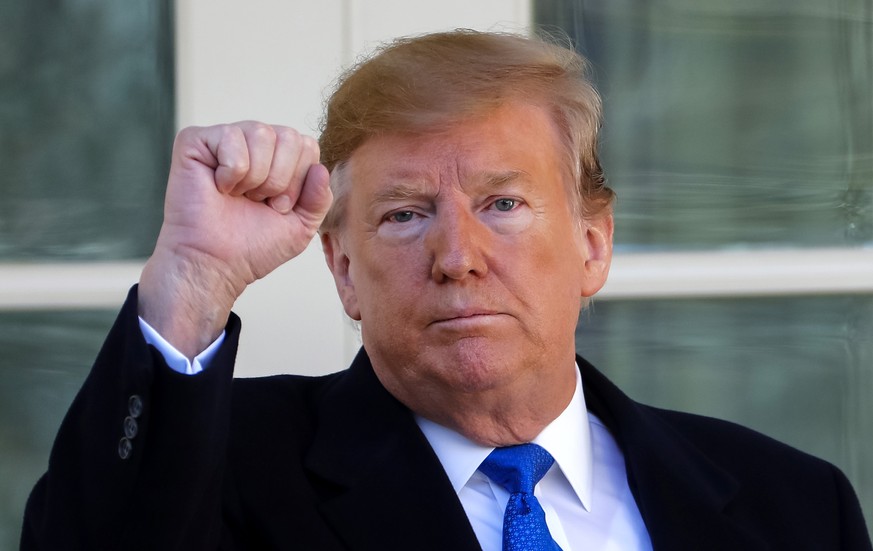 epa07373255 US President Donald J. Trump reacts as he leaves after speaking about a 328 billion USD (290.7 billion euro) spending bill to prevent another government shutdown at the Rose Garden of the  ...