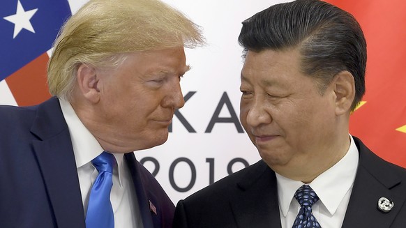 FILE - In this Saturday, June 29, 2019, file photo, U.S. President Donald Trump, left, meets with Chinese President Xi Jinping during a meeting on the sidelines of the G-20 summit in Osaka, Japan. Fou ...