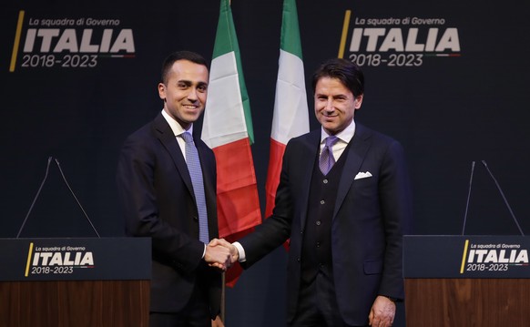 In this photo taken on Thursday, March 1, 2018, Giuseppe Conte, right, shakes hands with leader of the Five-Star Movement, Luigi Di Maio, during a meeting in Rome. Italian media describe Conte as most ...