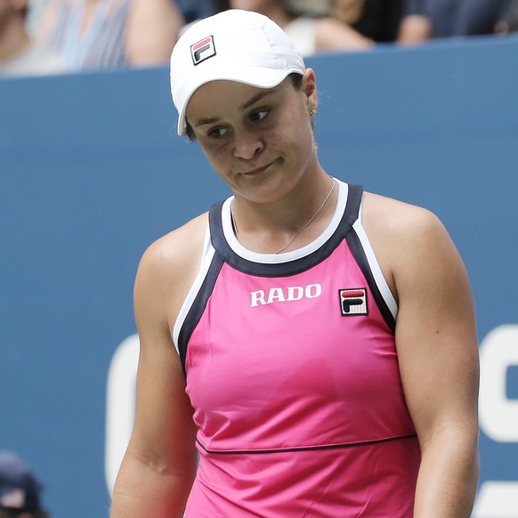 epa07810769 Ashleigh Barty of Australia reacts as she plays Qiang Wang of China during their match on the seventh day of the US Open Tennis Championships the USTA National Tennis Center in Flushing Me ...