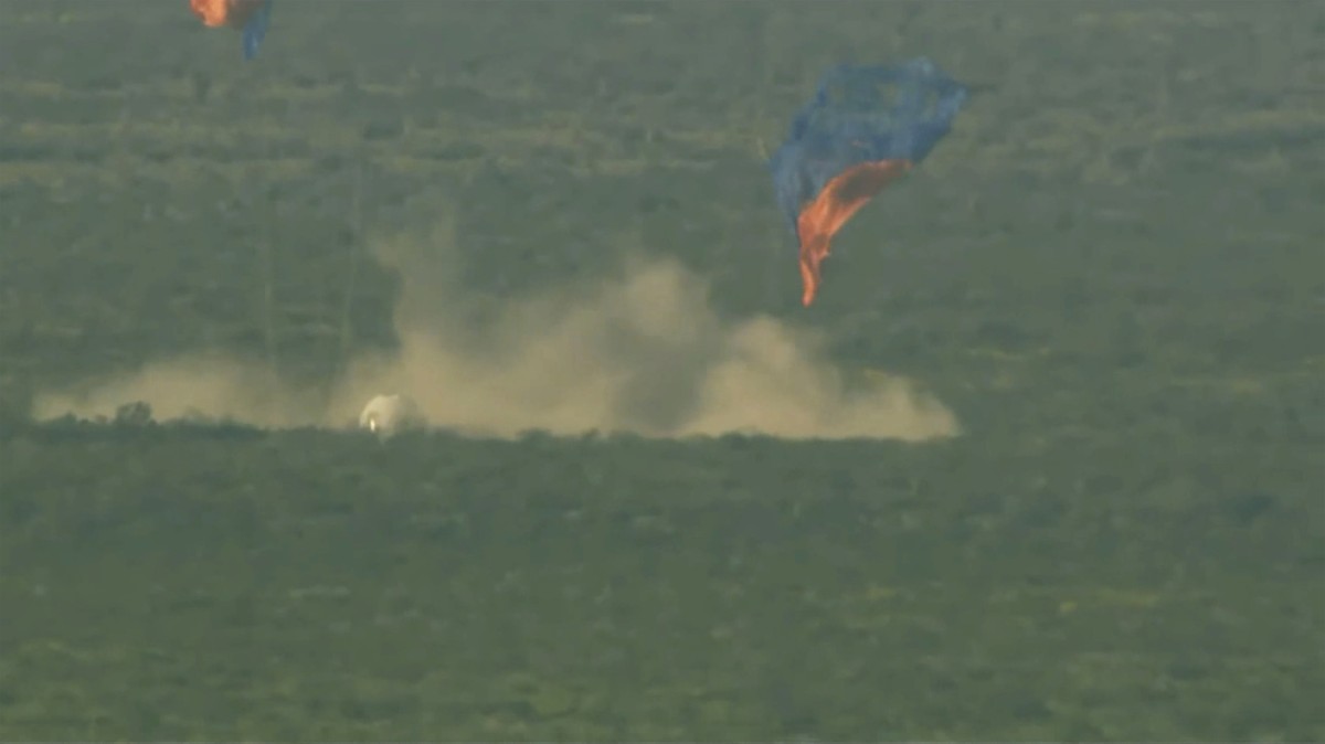 This image provided by Blue Origin shows a capsule containing science experiments after a launch failure and parachuting onto the desert floor on Monday, Sept. 12, 2022. Jeff Bezos' rocket compan ...