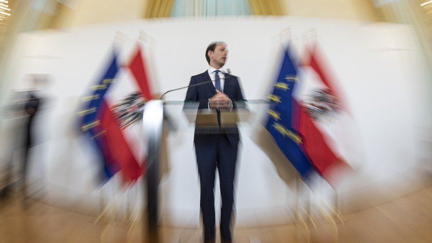 epa07592042 A picture taken with a fisheye lens shows Austrian Chancellor Sebastian Kurz speaking during a news conference ahead of the weekly cabinet meeting at the Austrian Chancellery building in V ...