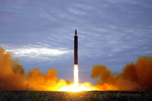 FILE - This Aug. 29, 2017 file photo distributed on Aug. 30, 2017, by the North Korean government shows what was said to be the test launch of a Hwasong-12 intermediate range missile in Pyongyang, Nor ...